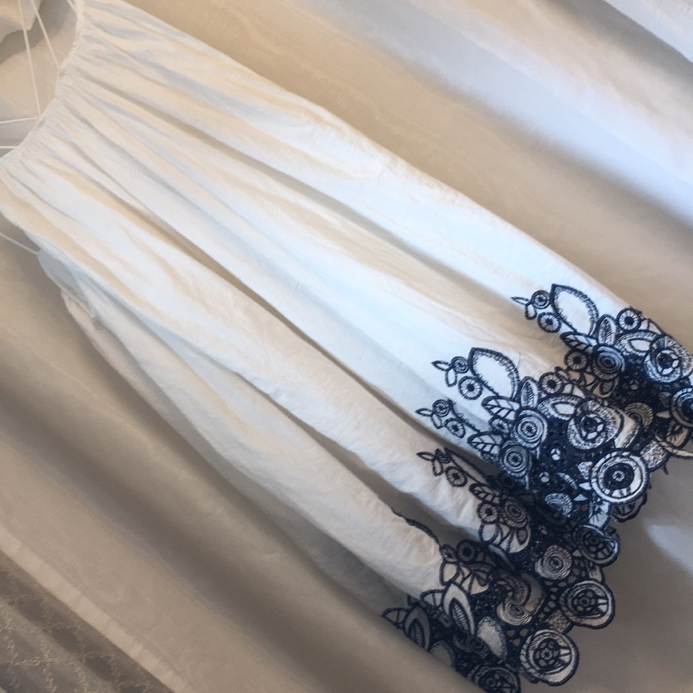 NWOT white sundress with blue embroidery.
